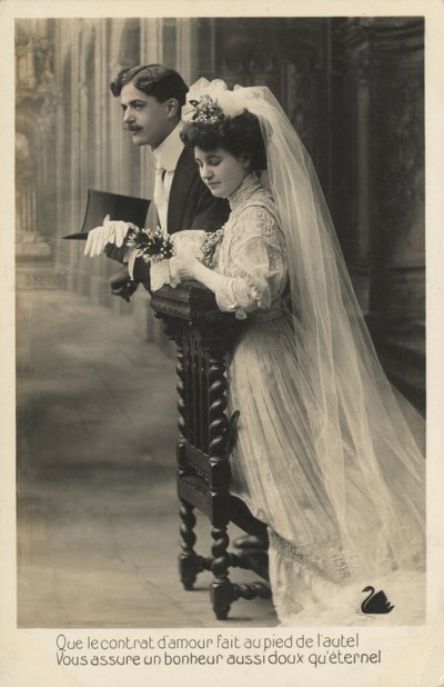 Bride and groom kneeling by French Photographer